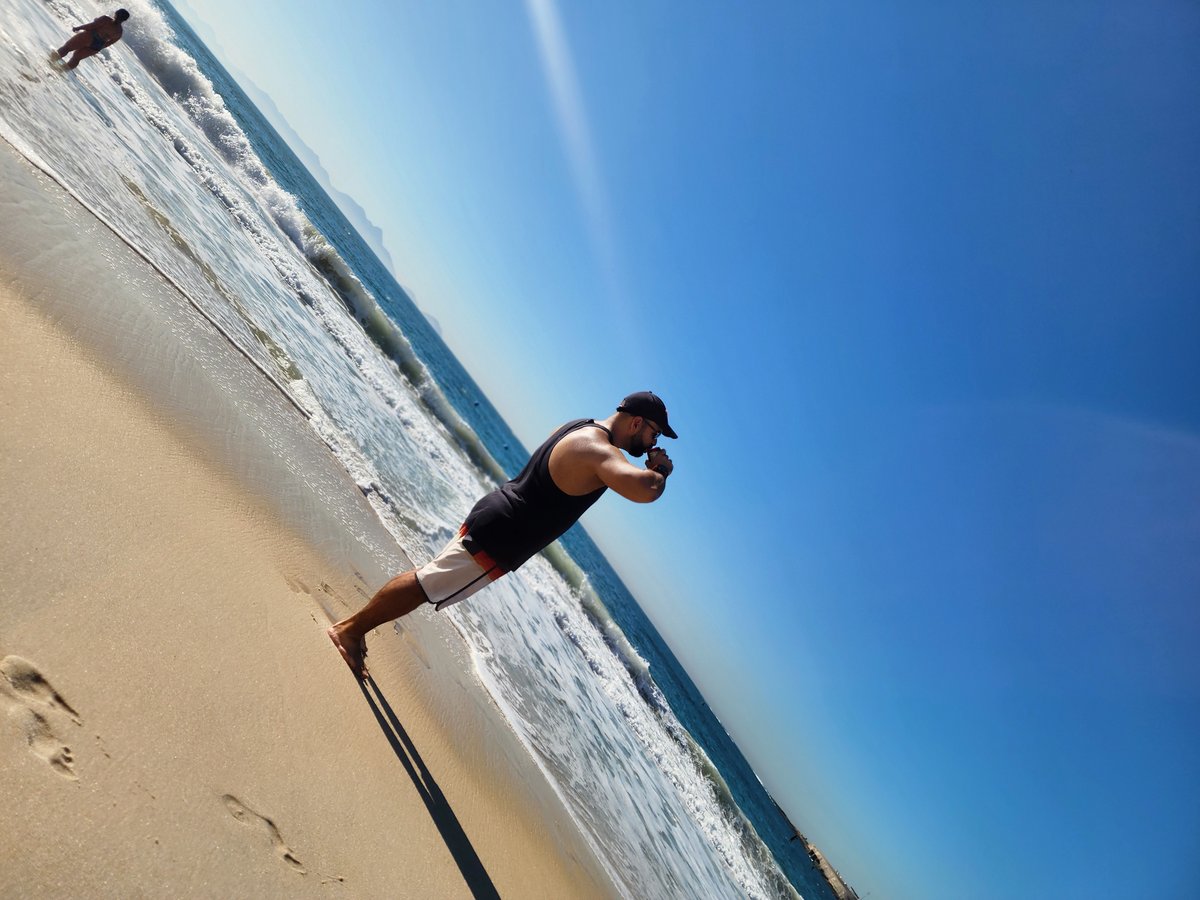 Renzo fighting stance on beach — June 2025